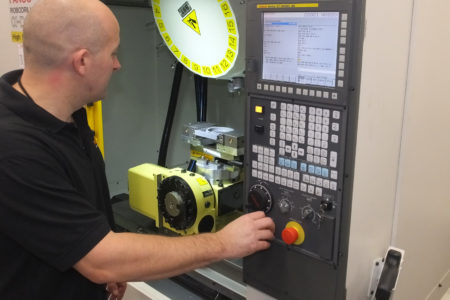 An operator using a CNC machine enjoys the advantages of multi-axis machining