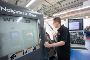 The use of a Nakamura-Tome CNC machine.